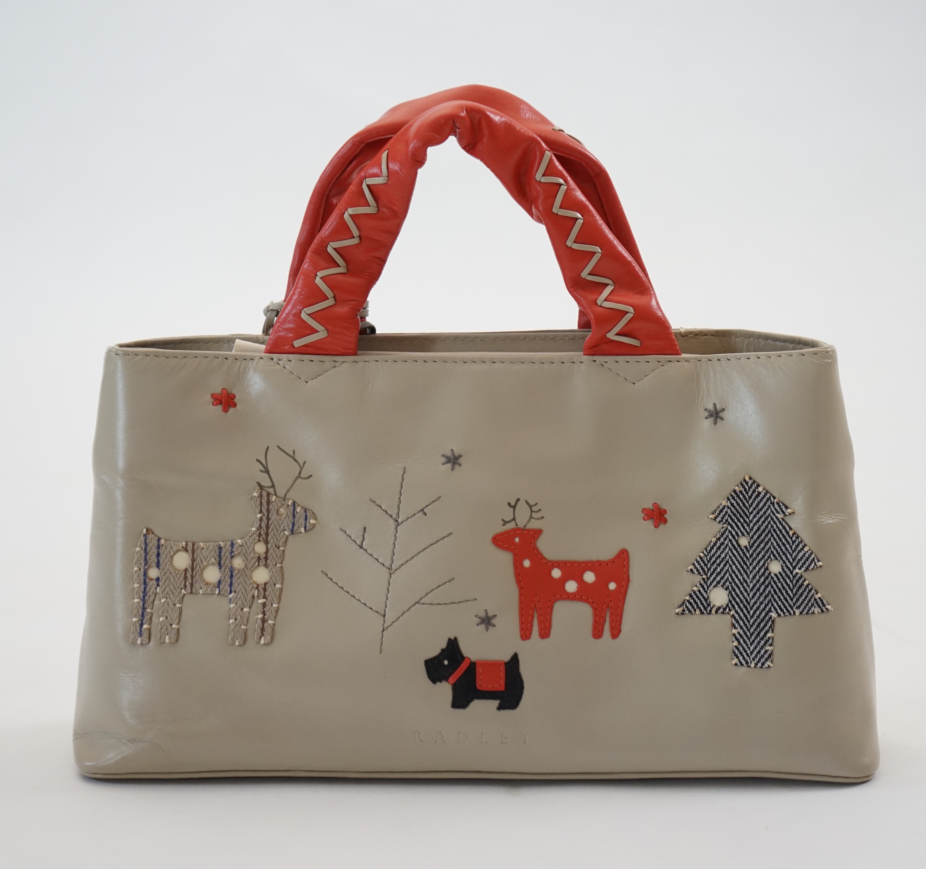 A Radley 'Seasons Greeting Reindeer Christmas' leather grab handle bag 2005, width 30cm, depth 8cm, height 16cm